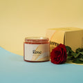 Rose body scrub jar with a red rose on a blue and yellow background
