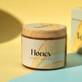 Jar of Honey Body Scrub on a yellow and blue background