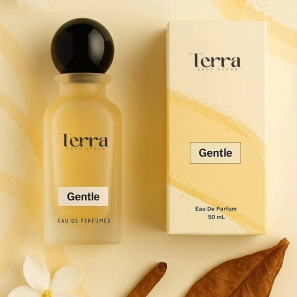 Terra Gentle Eau de Parfum bottle and packaging on a beige background with floral and leaf elements.