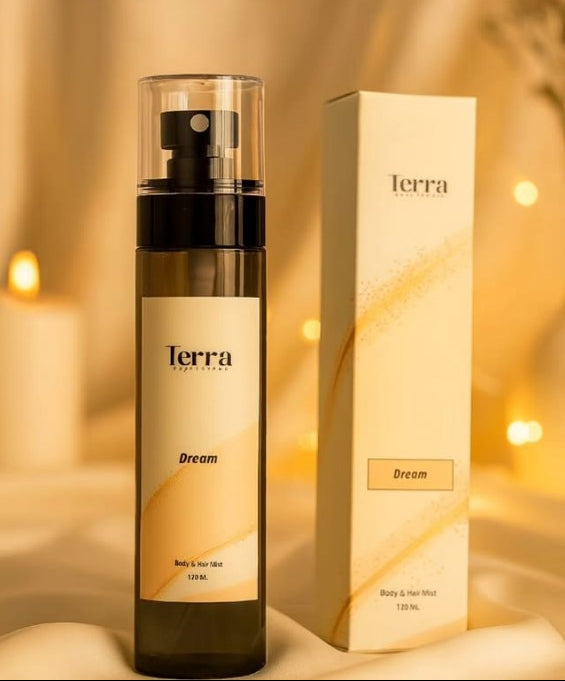 Terra Dream body & hair mist with packaging on a warm, blurred background